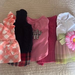 Cute dresses and sweaters for very small dog.  These fit my Morky at 3-4 lbs.